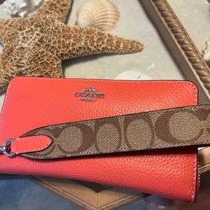 Coral COACH large wristlet/wallet
